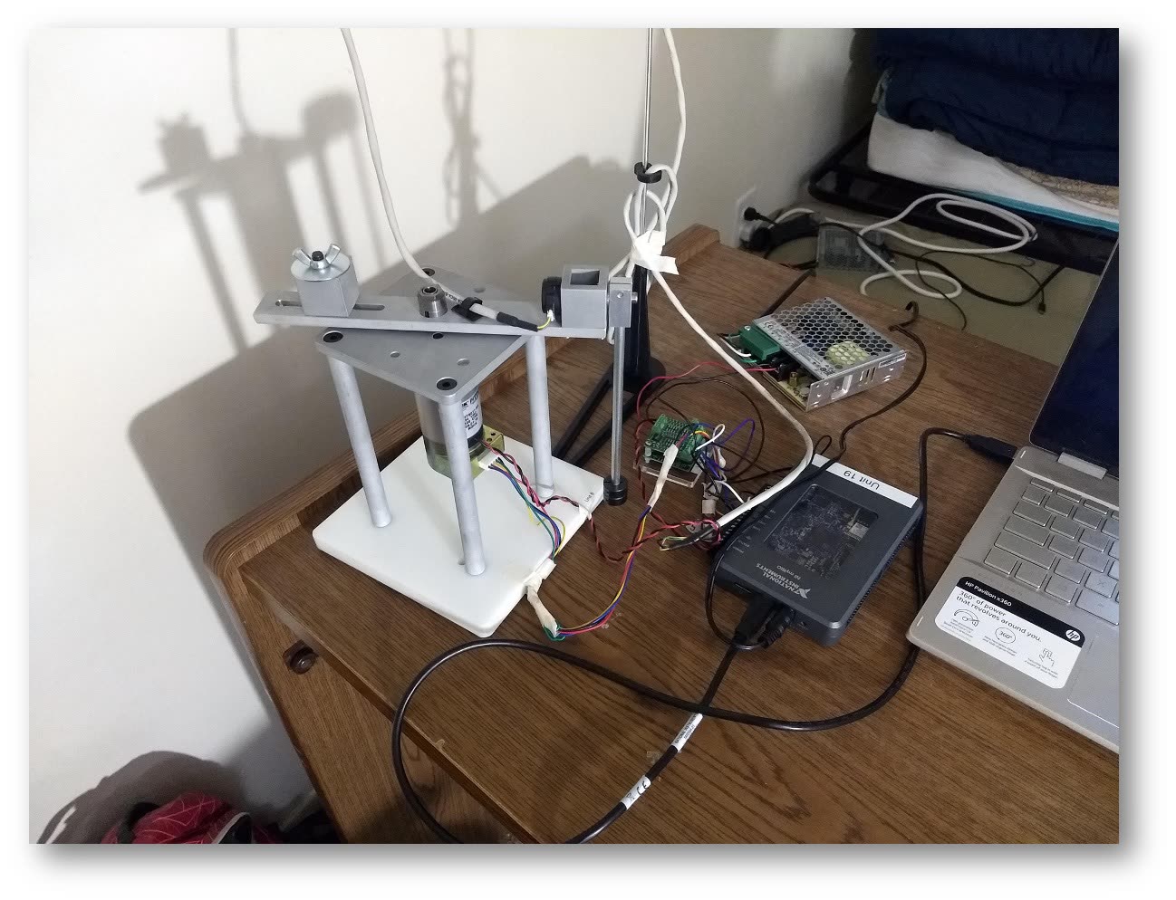 Inverted pendulum mechatronics assembly